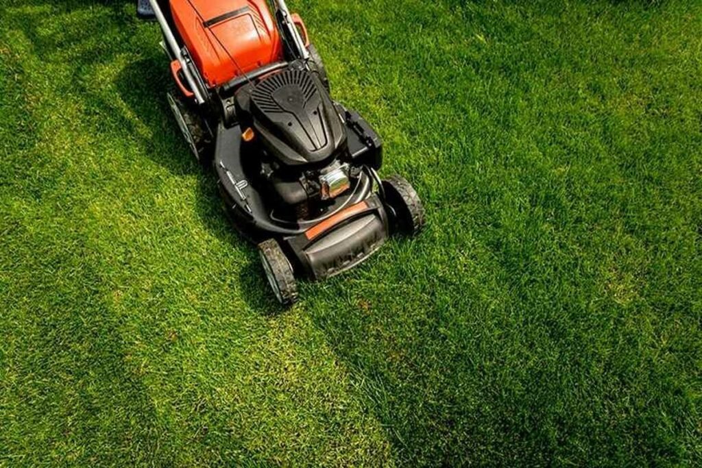 mowing the lawn Colonial Lawn & Garden
