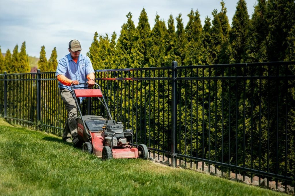 commercial lawn maintenance provider mowing the lawn